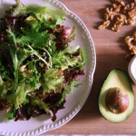 Leafy salad with avocado and toasted walnuts
