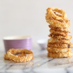 Oven baked crispy spicy onion rings with lime chilli yoghurt dip