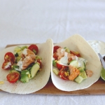 Spicy salmon soft tacos with avocado, cherry tomato & corn salsa